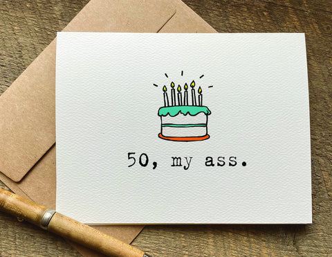 50 my ass a card with a birthday cake with candles on it