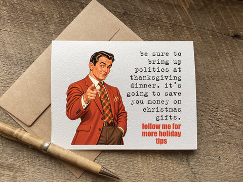 A novelty greeting card with a vintage-style illustration of a man in a red suit pointing forward, with text that reads: be sure to bring up politics at thanksgiving dinner. it’s going to save you money on christmas gifts.  follow me for more holiday tips
