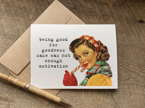Card with vintage-style illustration of a woman eating candy canes, text 'being good for goodness sake was not enough motivation', 