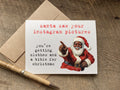 funny christmas card with a black santa that reads: santa saw your instagram pictures. you're getting clothes and a bible for christmas
