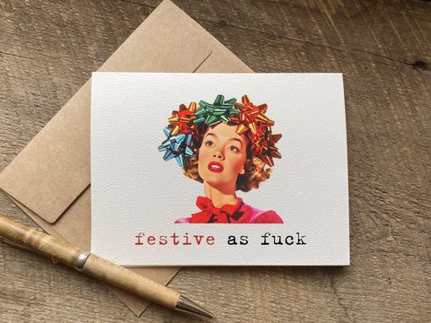 funny christmas Card with a graphic of a woman wearing colorful bows on her head and text 'festive as fuck' 
