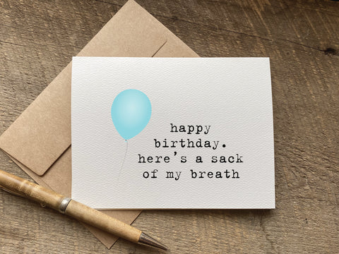 funny snarky birthday card with a balloon clip art that says: happy birthday. here's a sack of my breath