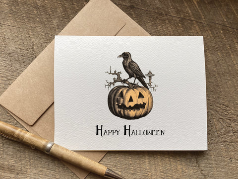 happy halloween card with vintage style graphic of a crow and pumpkin
