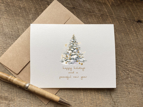 pretty minimalist christmas card that says "happy holidays and a peaceful new year"
