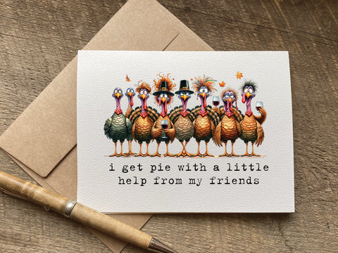 funny thanksgiving / friendsgiving card that says "i get pie with a little help from my friends" featuring funny turkeys holding wine glasses