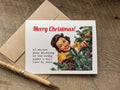 A funny Christmas greeting card with a retro illustration of a woman decorating a tree and the text 'Merry Christmas! if anyone puts anything in the wrong place i will lose my shit', 