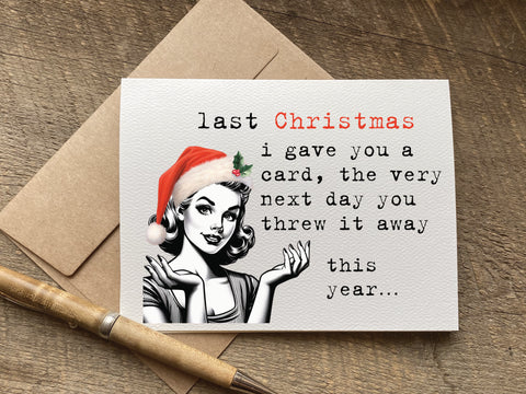 funny christmas card with vintage woman graphic wearing a santa hat that reads: last Christmas&nbsp;i gave you a card, the very next day you threw it away. this year...