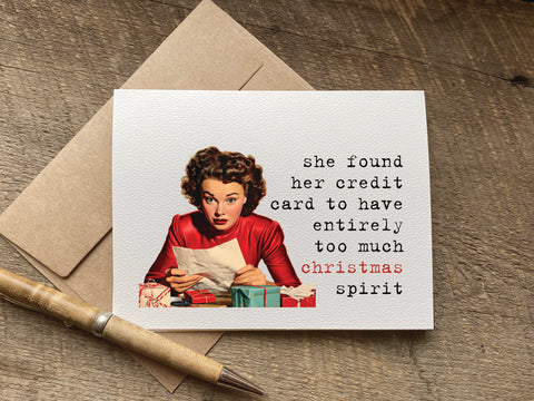 Card with vintage-style illustration of a woman and humorous text that says: she found her credit card to have entirely   too much christmas spirit