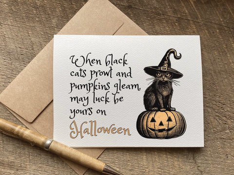 vintage black cat graphic halloween card that says: When black cats prowl and pumpkins gleam, may luck be yours on 