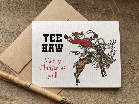 retro cowboy christmas card that says: yee haw merry christmas ya'll