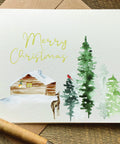 merry christmas pretty scenery christmas card with cabin in the woods